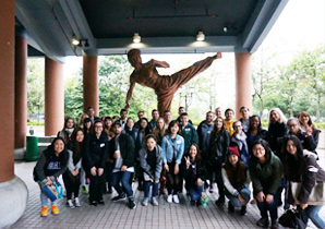 Group photo in front of the statue of Bruce Lee at the Hong Kong Heritage Museum